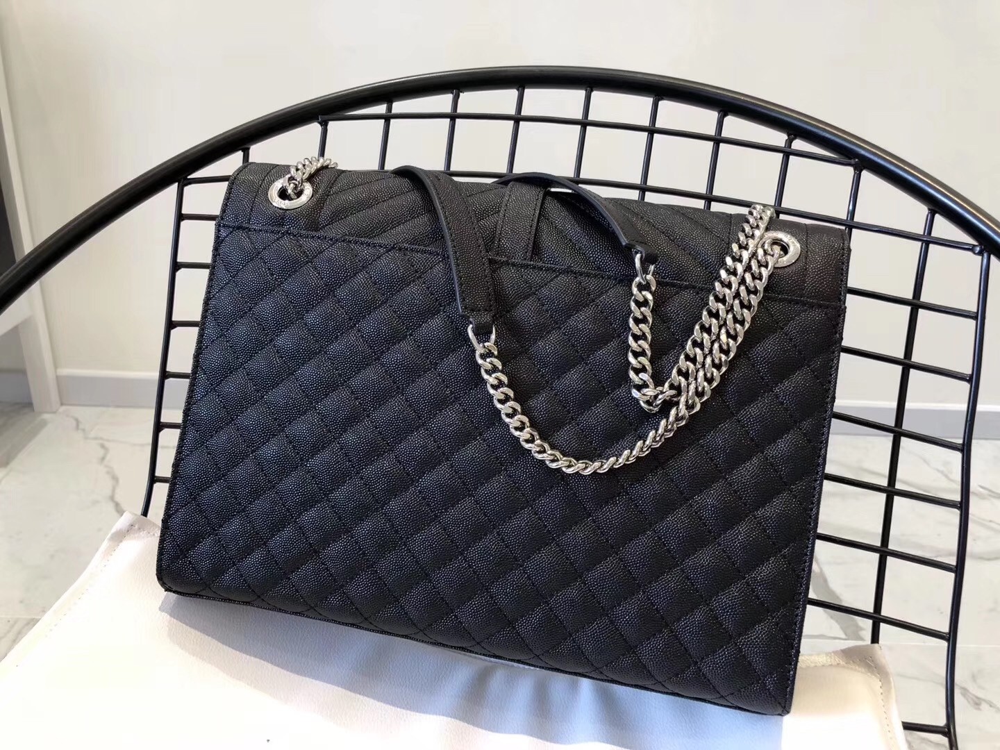 Sa**t Lau*nt envelope large bag in noir grained leather