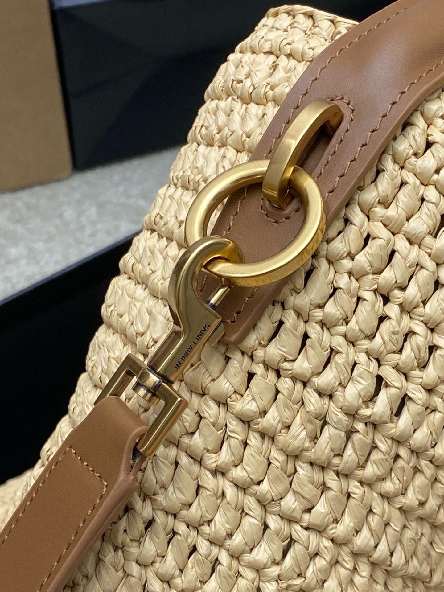 Sa**t Lau*nt le 37 bucket bag in natural woven raffia