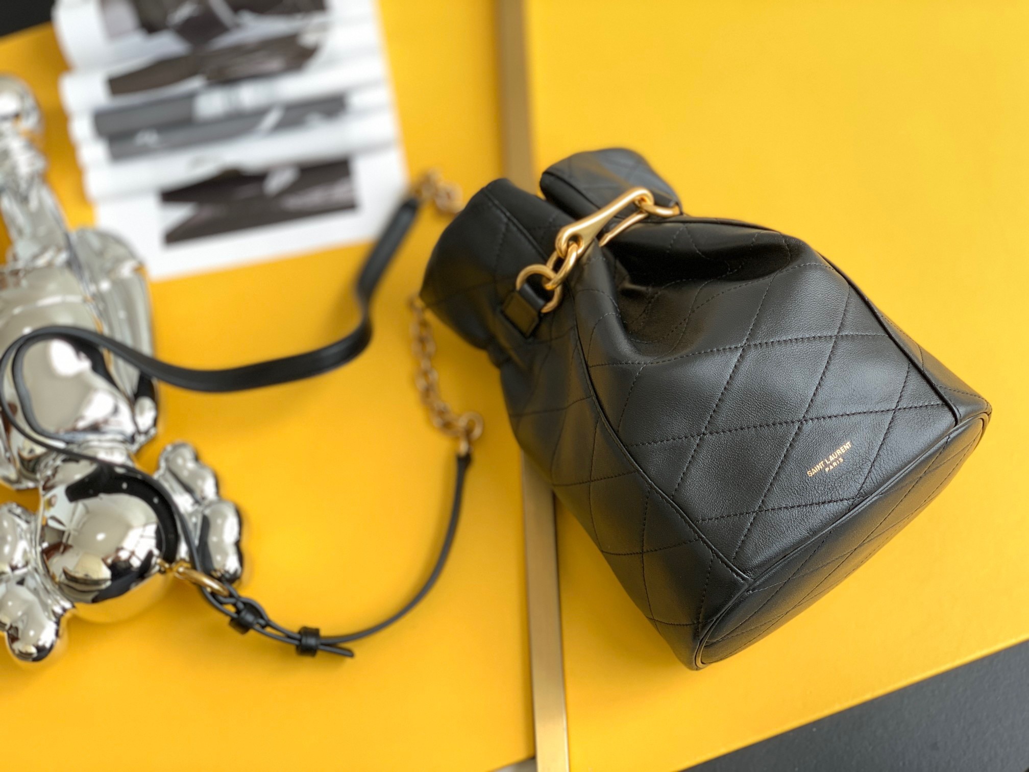 Sa**t Lau*nt le maillon hook bucket bag in black lambskin