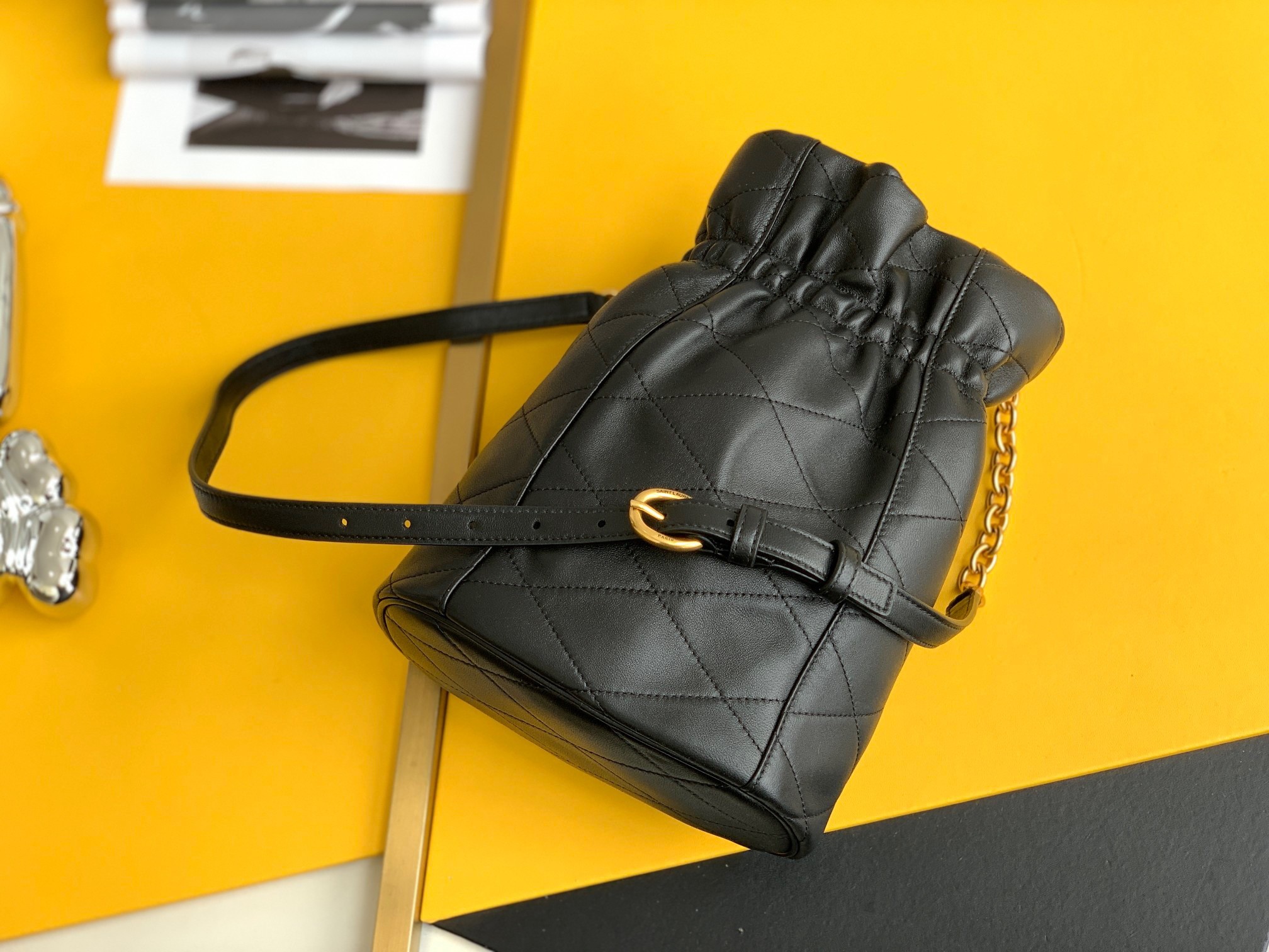 Sa**t Lau*nt le maillon hook bucket bag in black lambskin