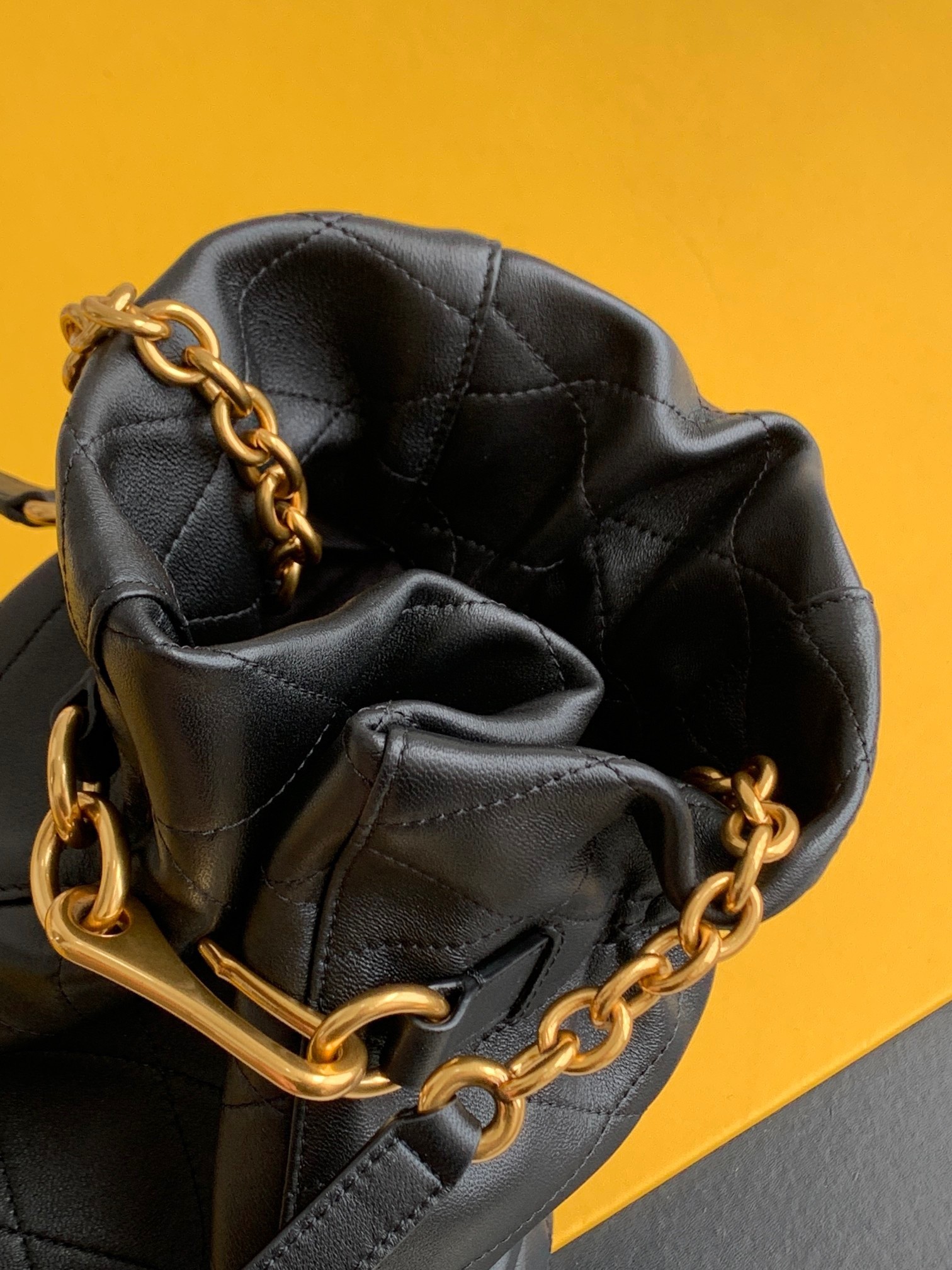 Sa**t Lau*nt le maillon hook bucket bag in black lambskin