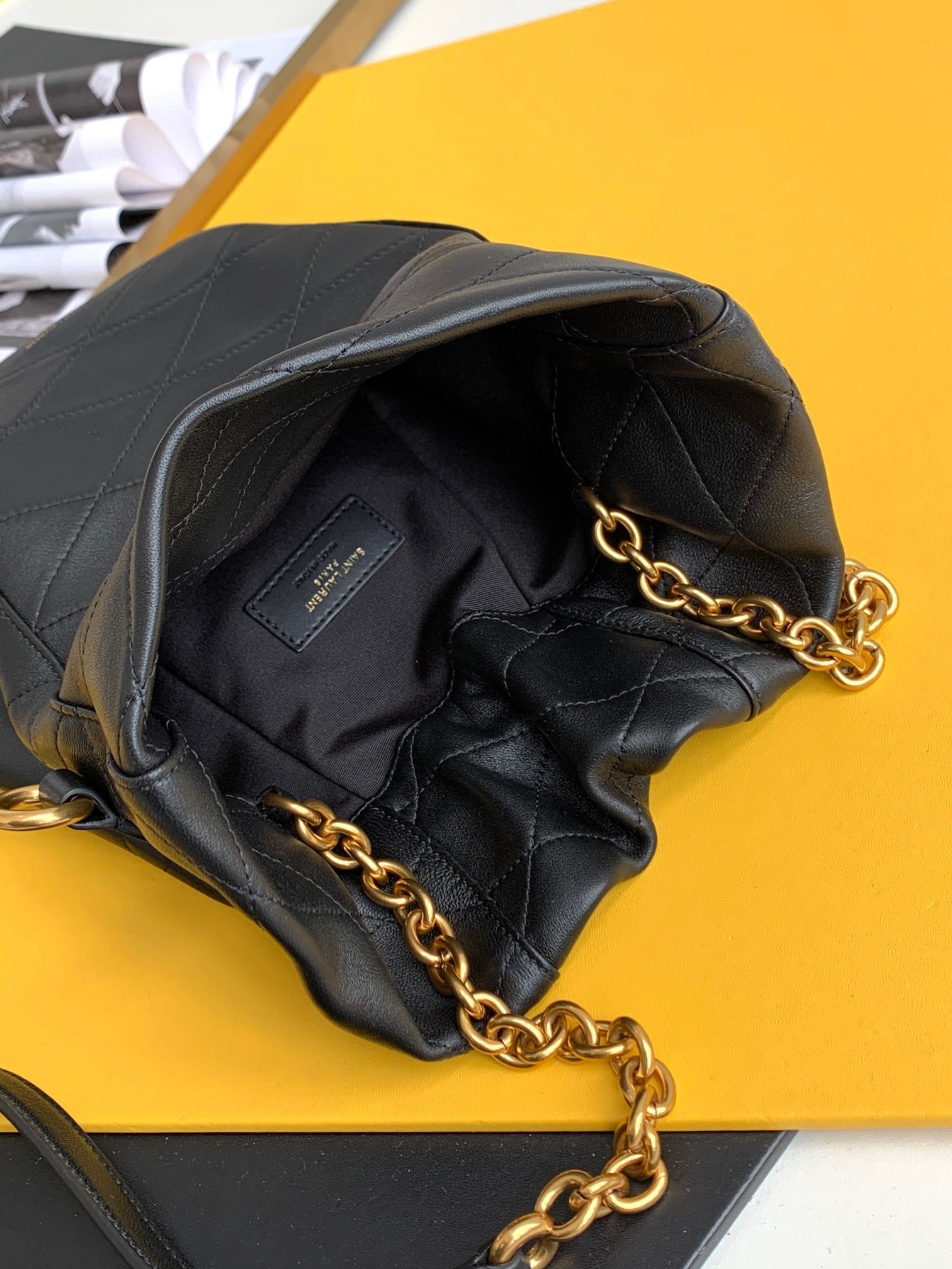 Sa**t Lau*nt le maillon hook bucket bag in black lambskin