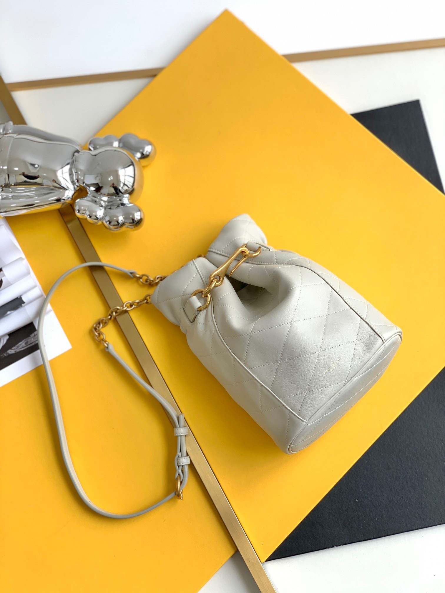 Sa**t Lau*nt le maillon hook bucket bag in white lambskin