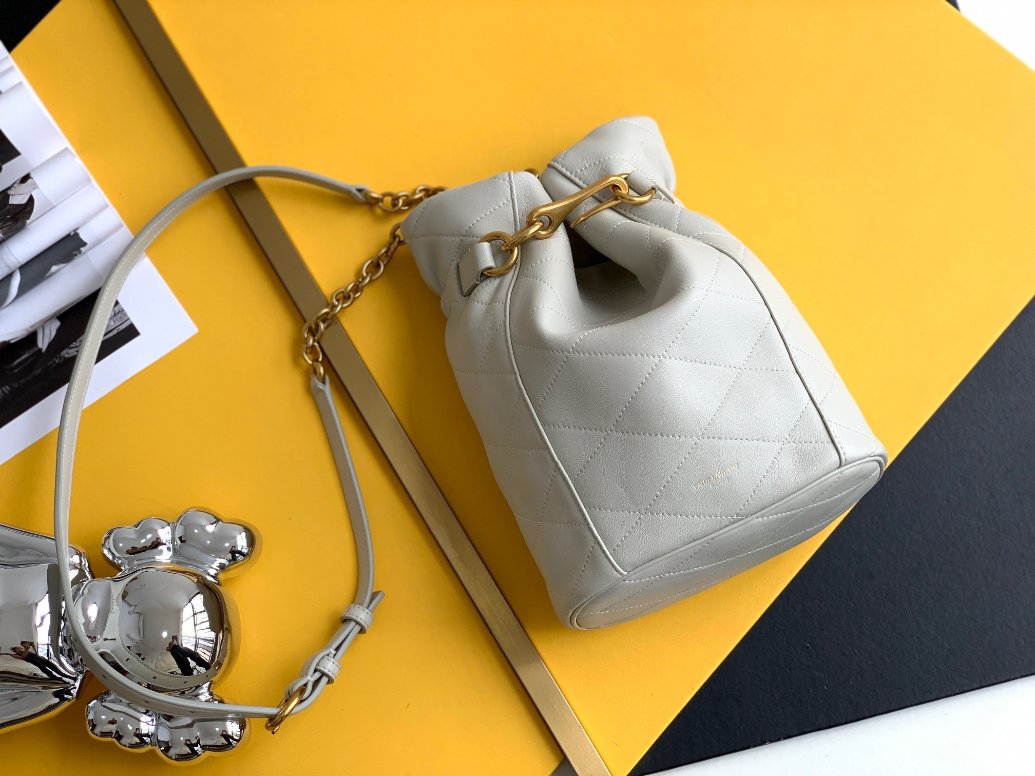Sa**t Lau*nt le maillon hook bucket bag in white lambskin