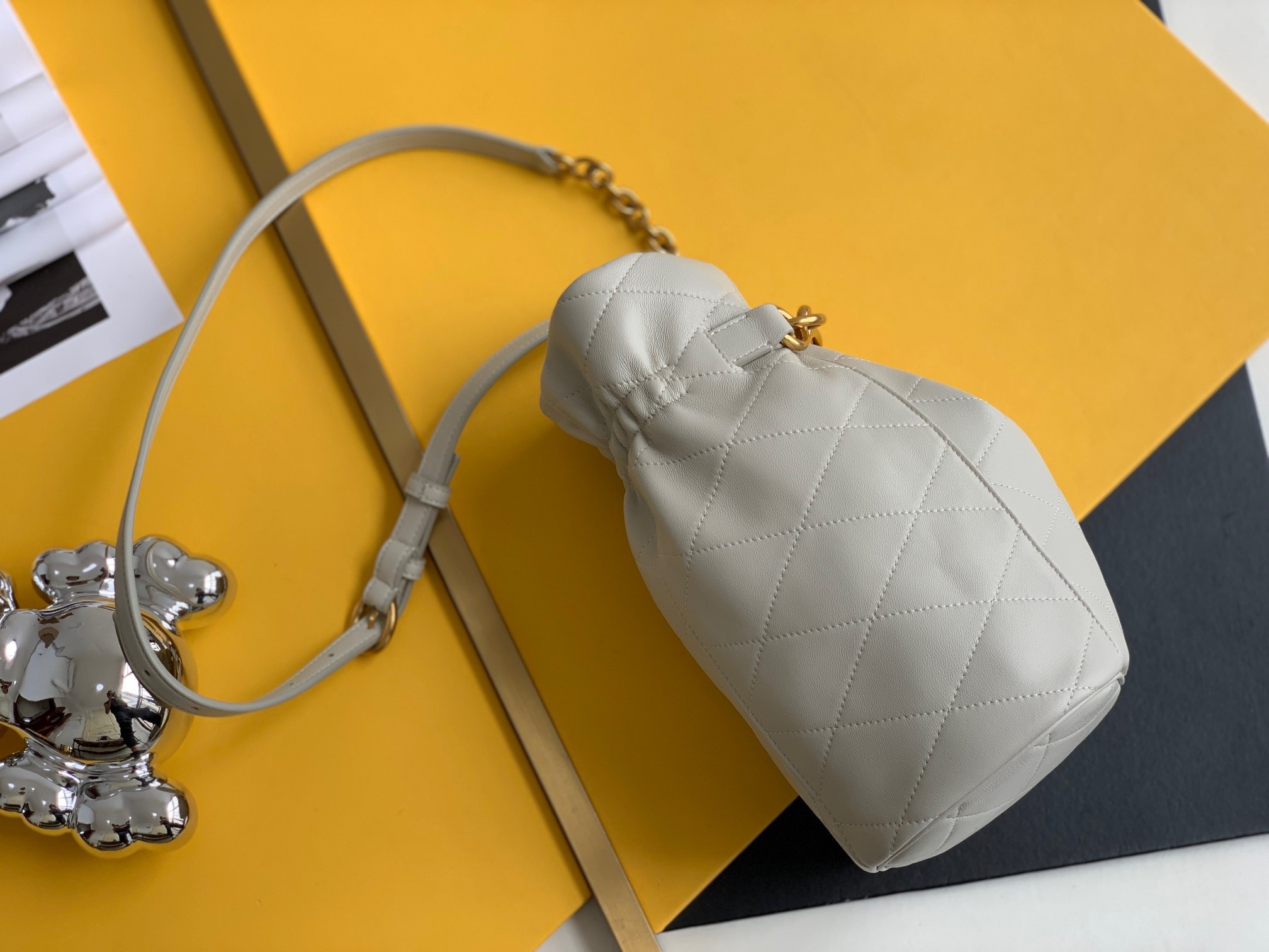 Sa**t Lau*nt le maillon hook bucket bag in white lambskin