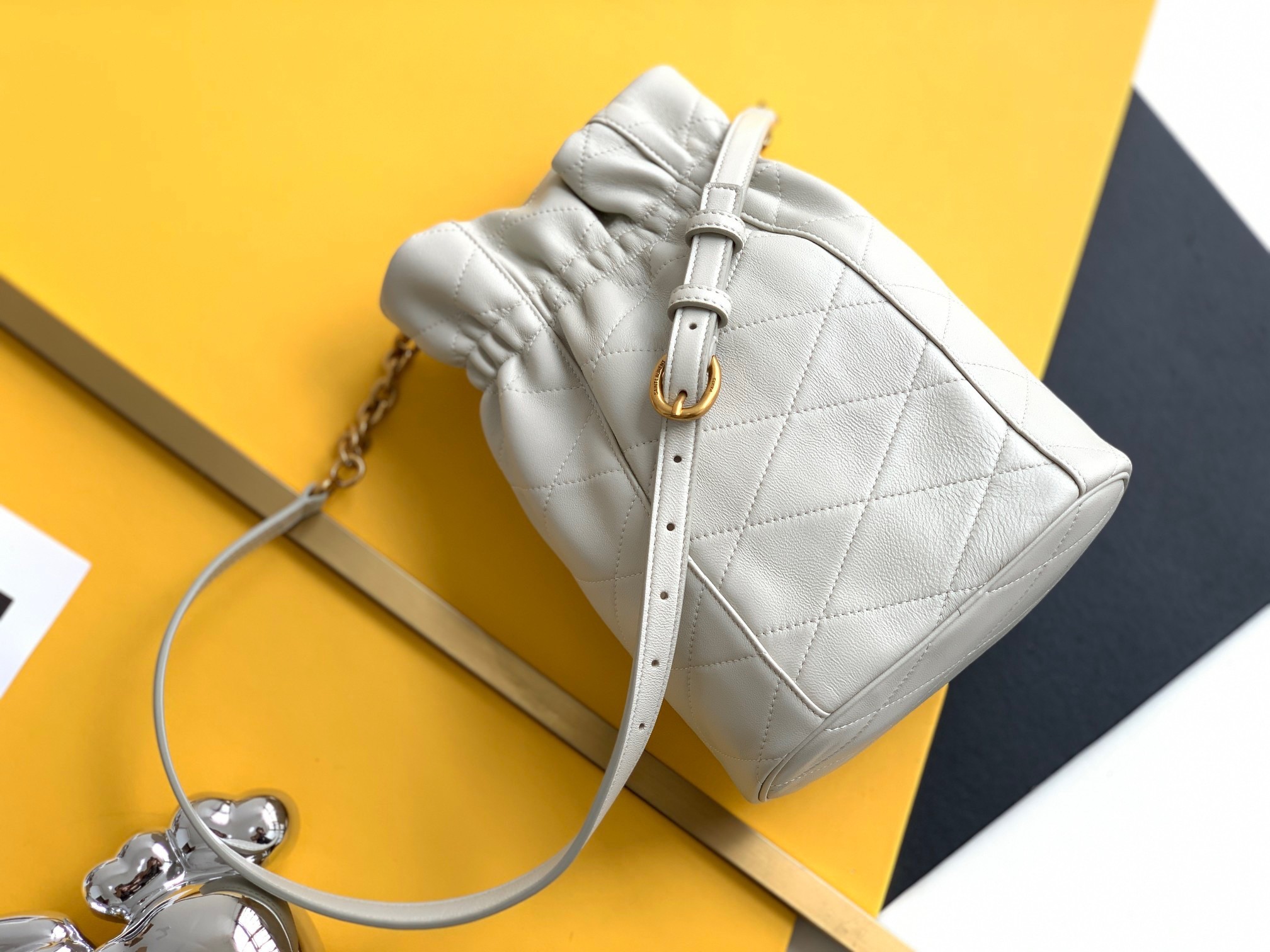 Sa**t Lau*nt le maillon hook bucket bag in white lambskin