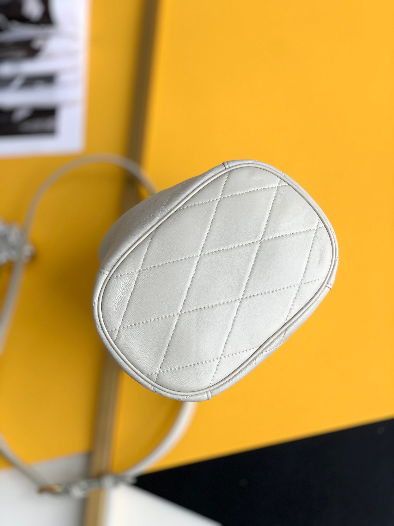 Sa**t Lau*nt le maillon hook bucket bag in white lambskin