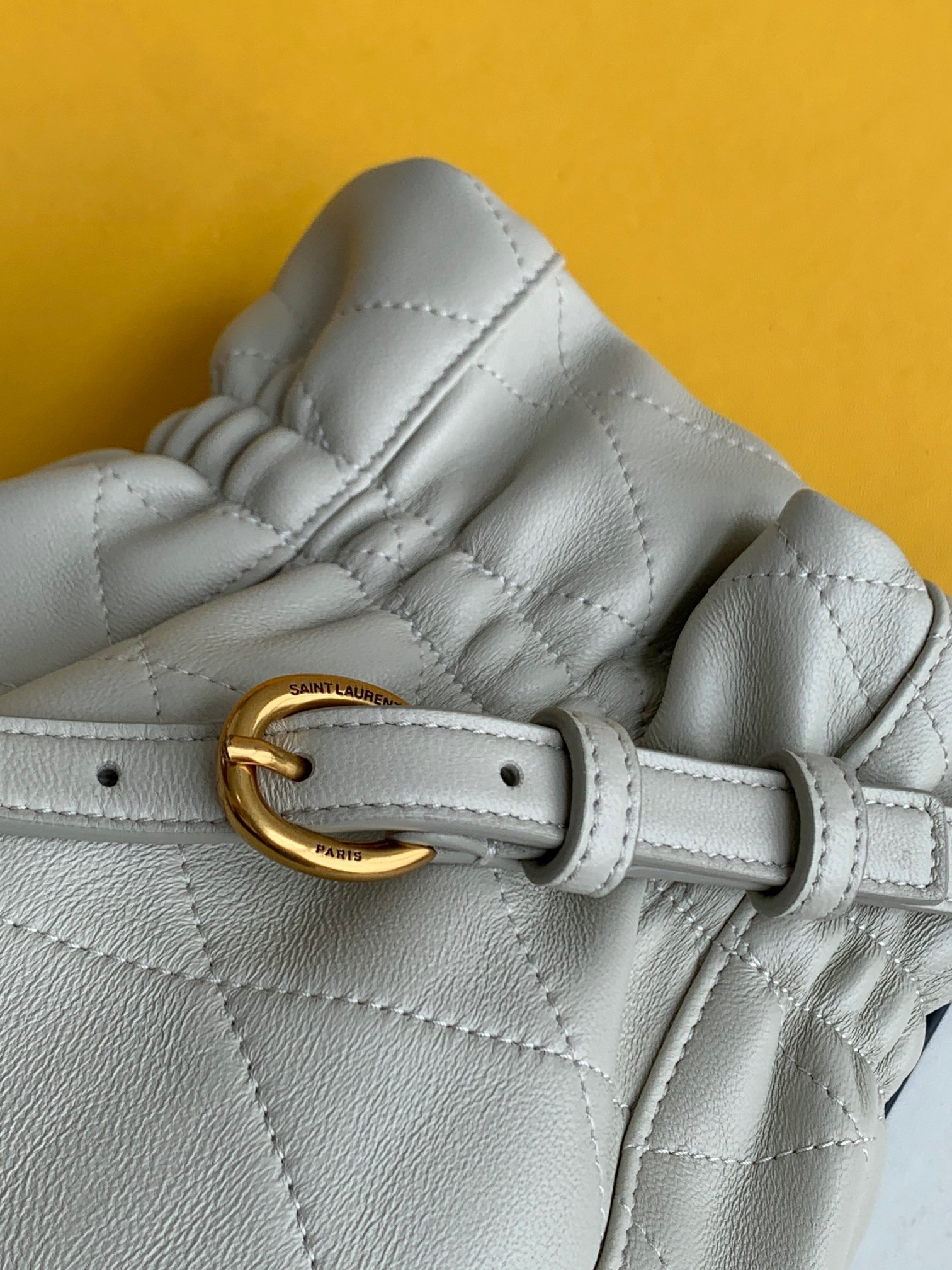 Sa**t Lau*nt le maillon hook bucket bag in white lambskin