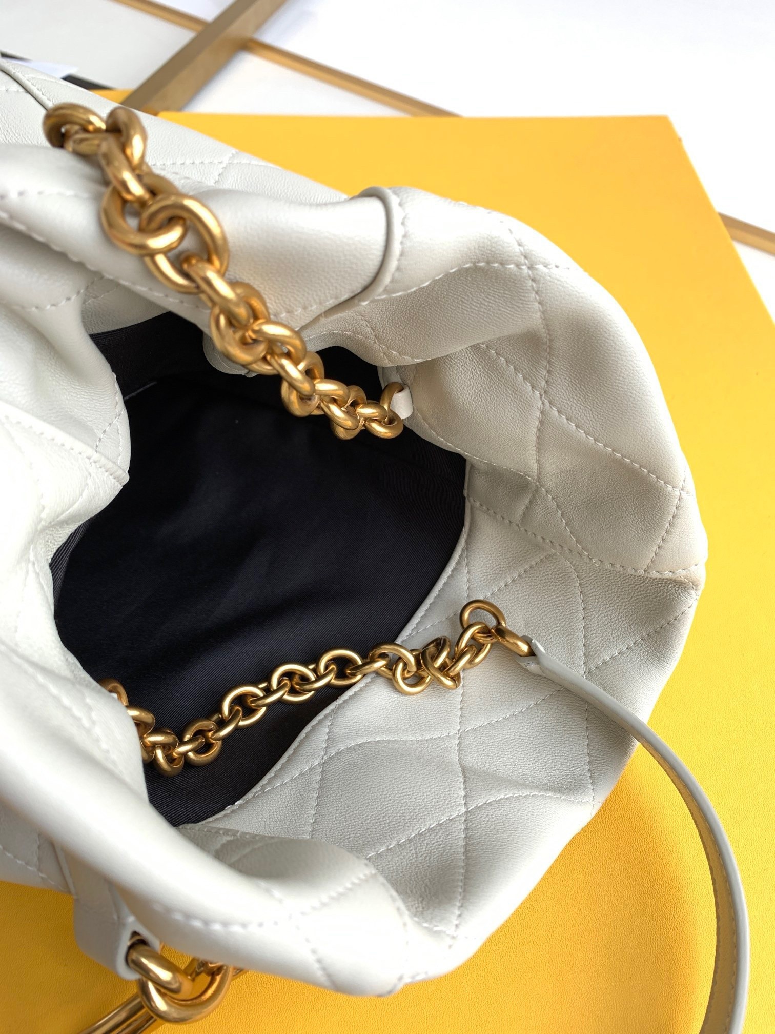 Sa**t Lau*nt le maillon hook bucket bag in white lambskin