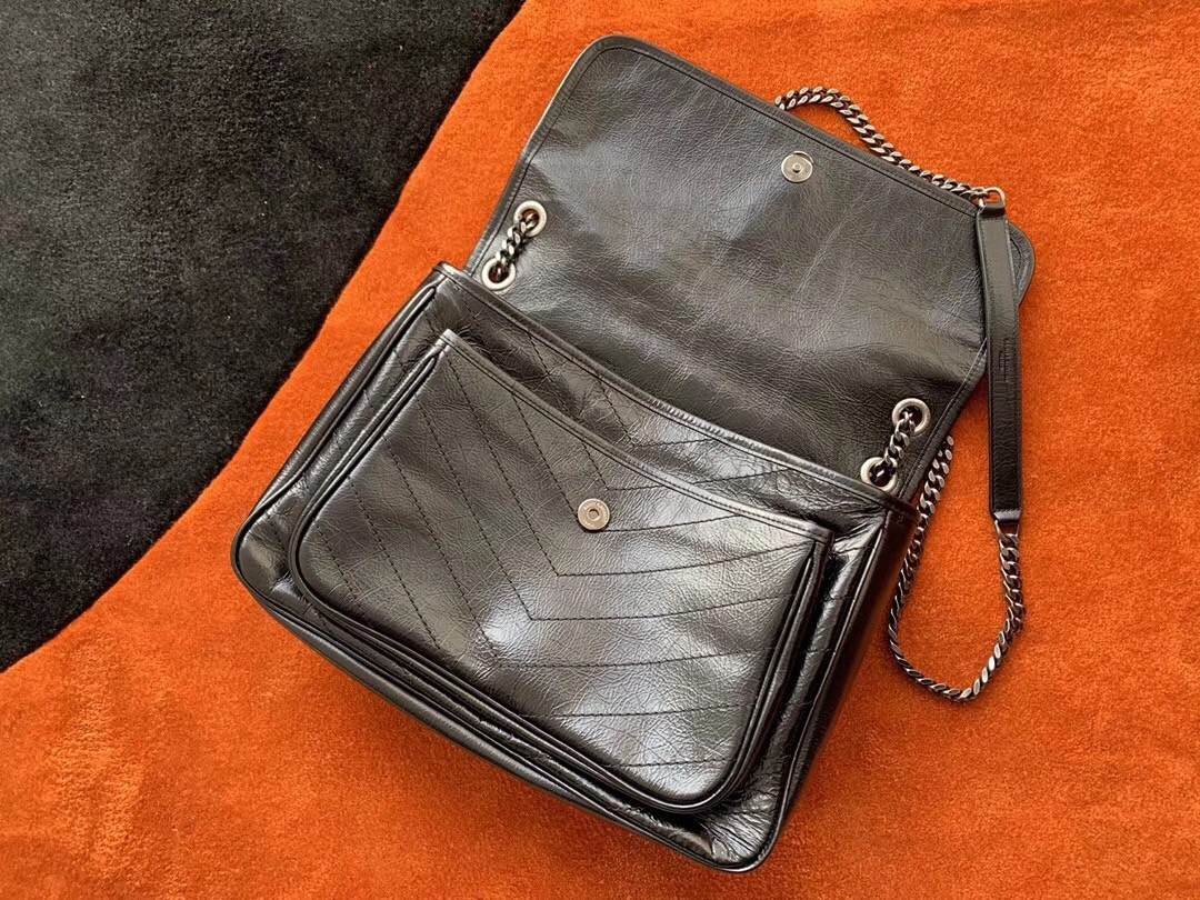 Sa**t Lau*nt medium niki bag in black crinkled leather