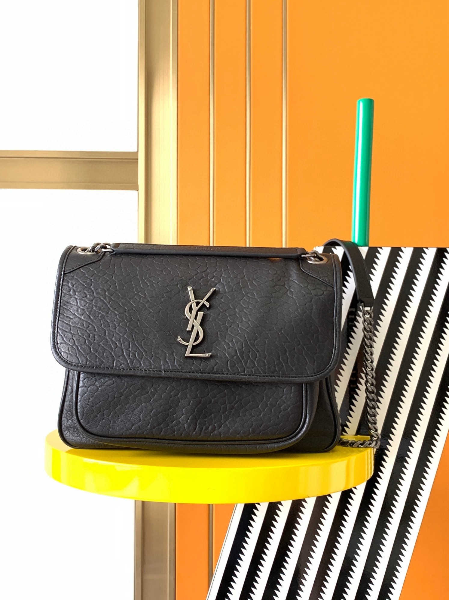 Sa**t Lau*nt niki medium chain bag in black grained lambskin