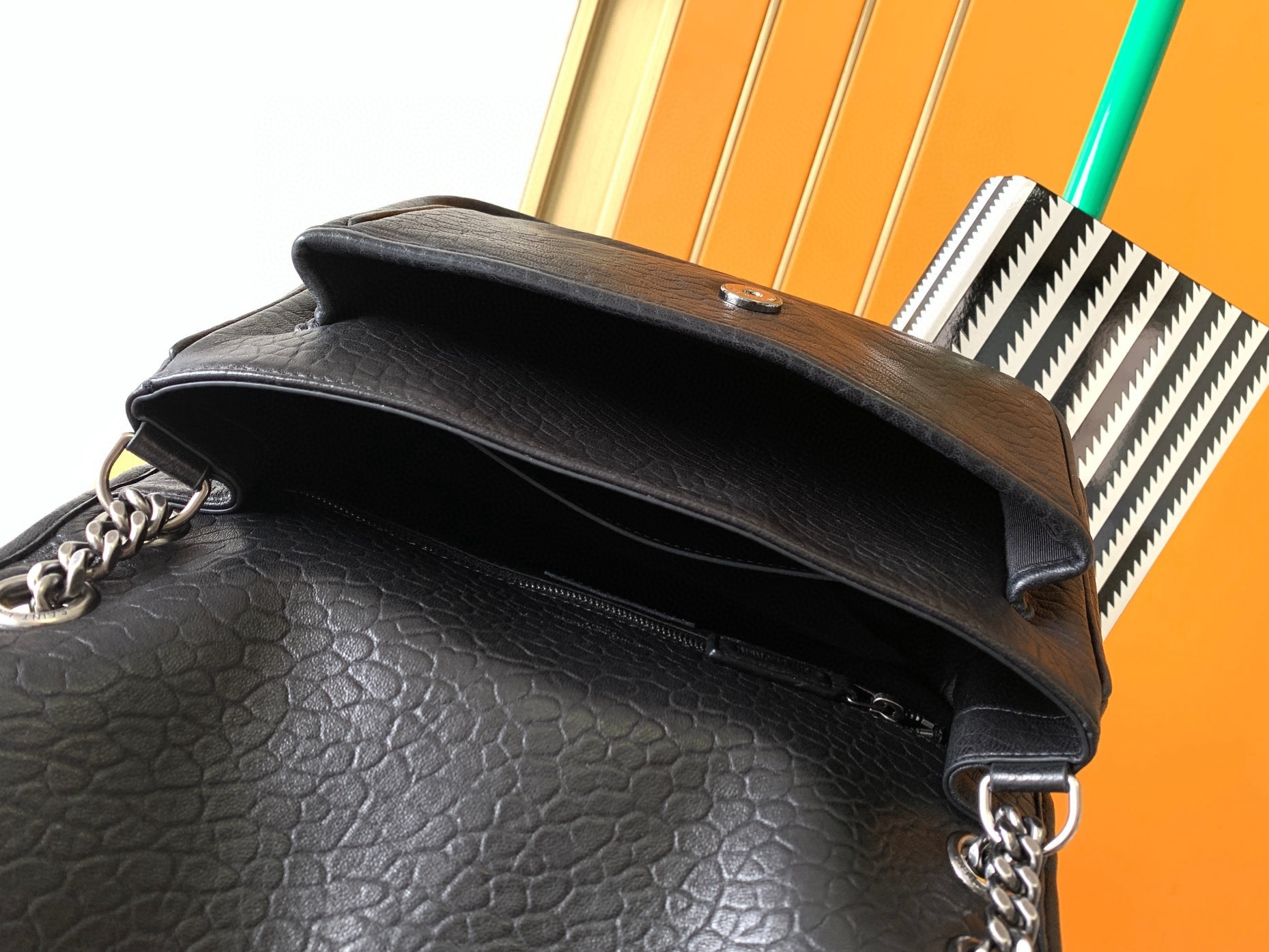 Sa**t Lau*nt niki medium chain bag in black grained lambskin