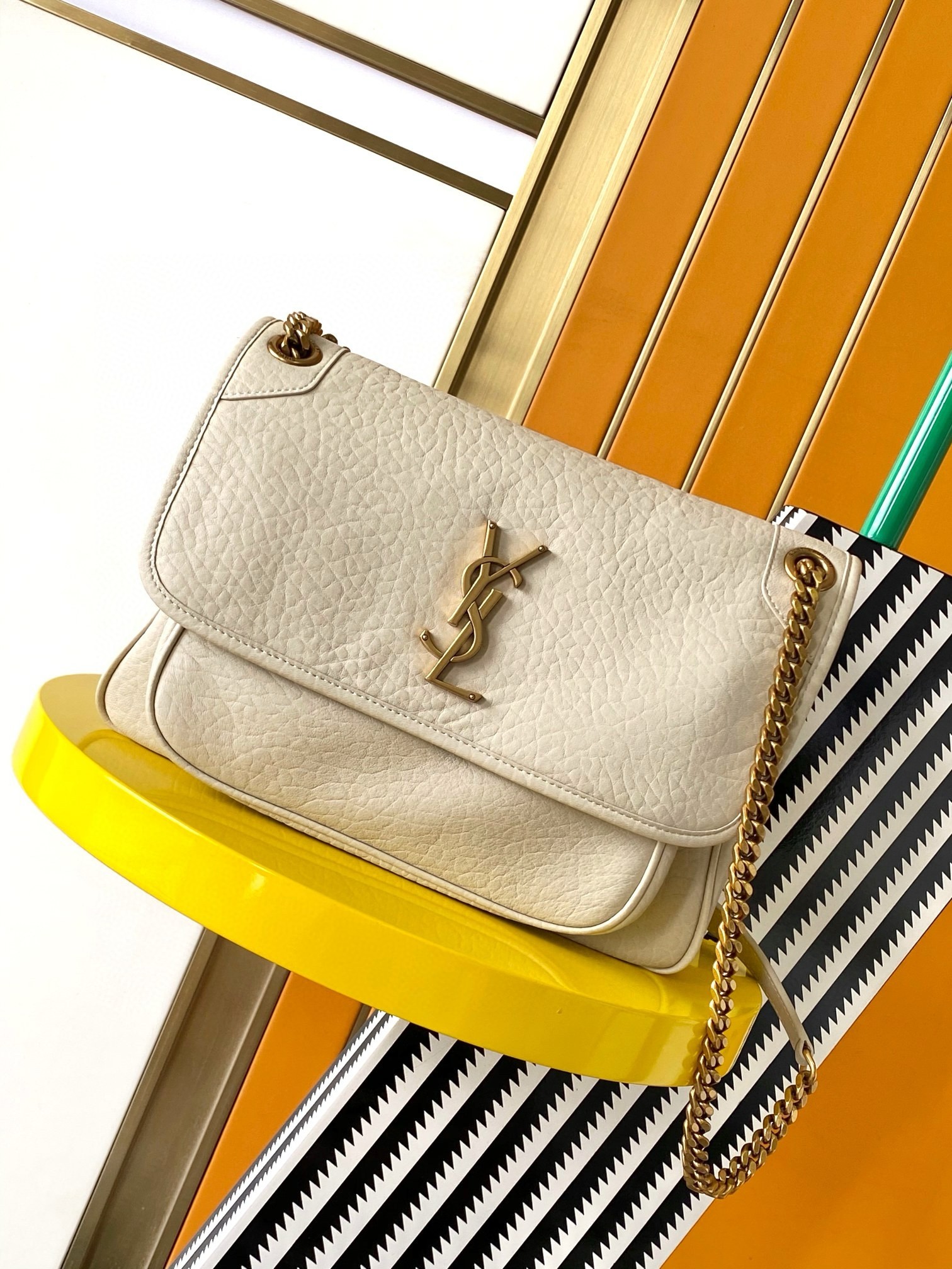 Sa**t Lau*nt niki medium chain bag in white grained lambskin