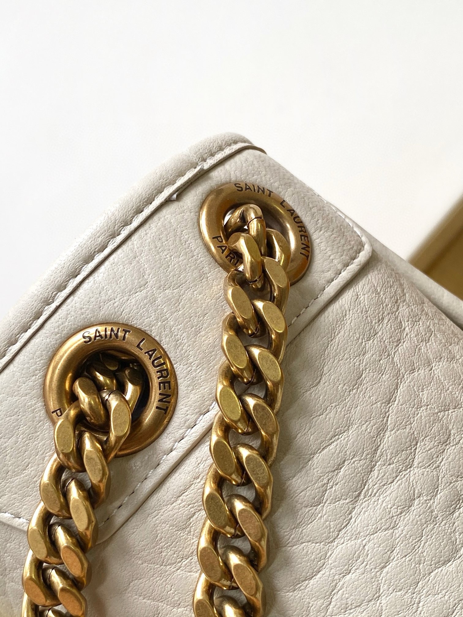 Sa**t Lau*nt niki medium chain bag in white grained lambskin