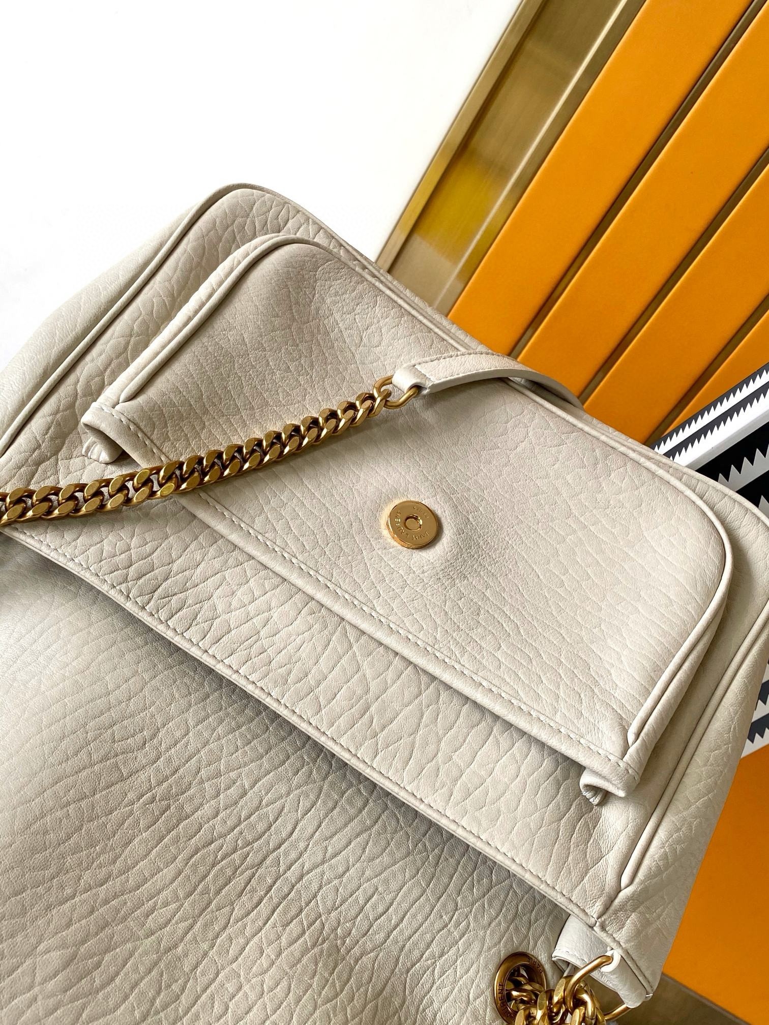 Sa**t Lau*nt niki medium chain bag in white grained lambskin