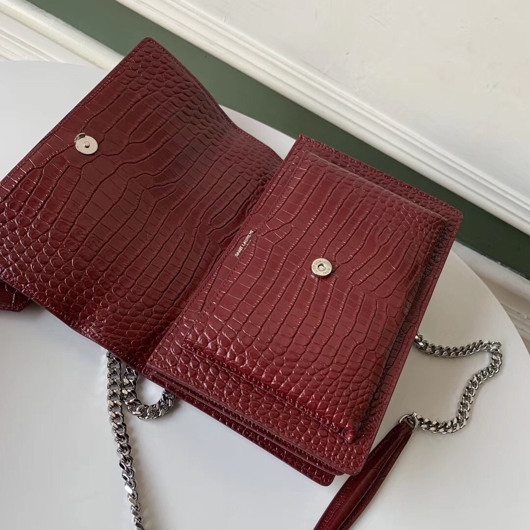 Sa**t Lau*nt sunset medium bag in bordeaux crocodile embossed leather