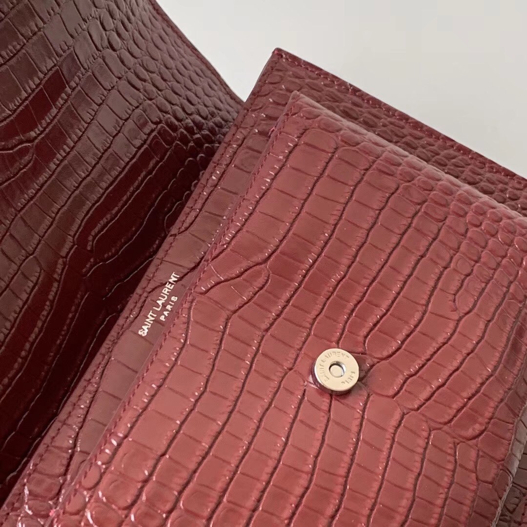 Sa**t Lau*nt sunset medium bag in bordeaux crocodile embossed leather
