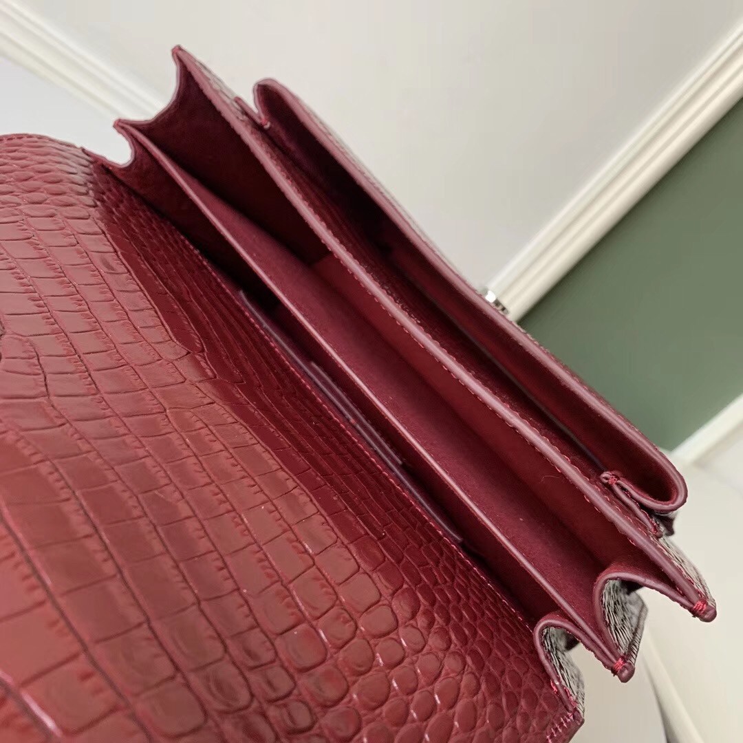 Sa**t Lau*nt sunset medium bag in bordeaux crocodile embossed leather