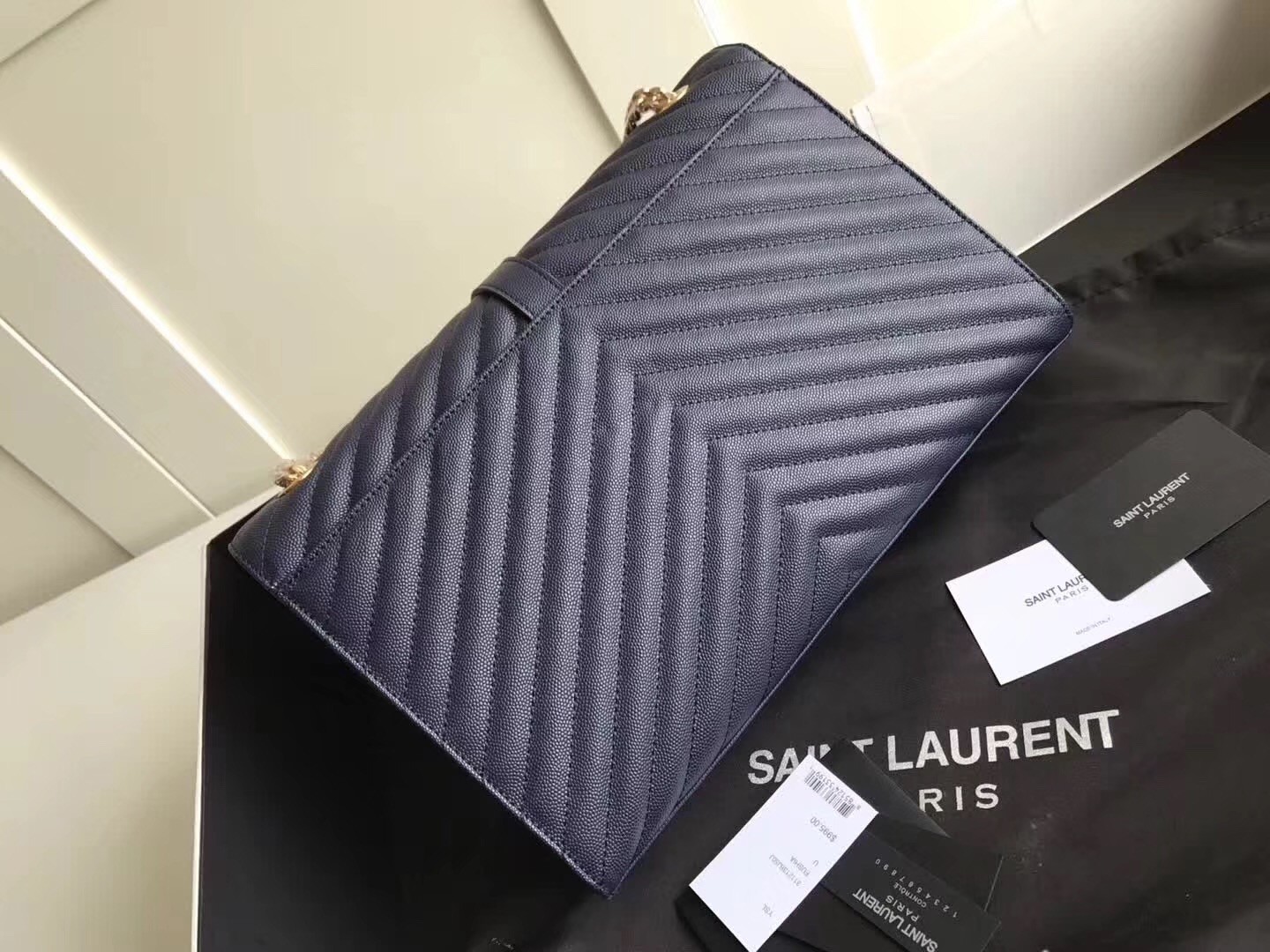 Sa**t Lau*nt envelope large bag in blue quilted leather