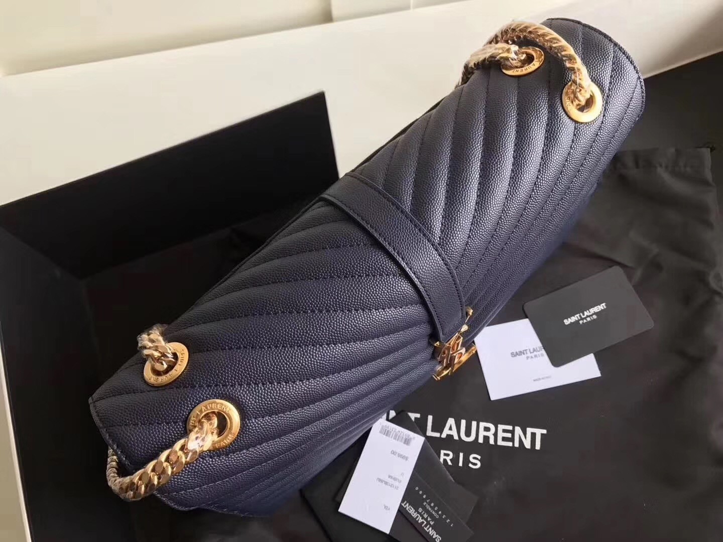 Sa**t Lau*nt envelope large bag in blue quilted leather