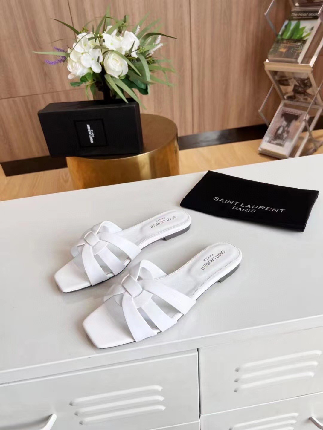 Sa**t Lau*nt tribute slides in white calfskin