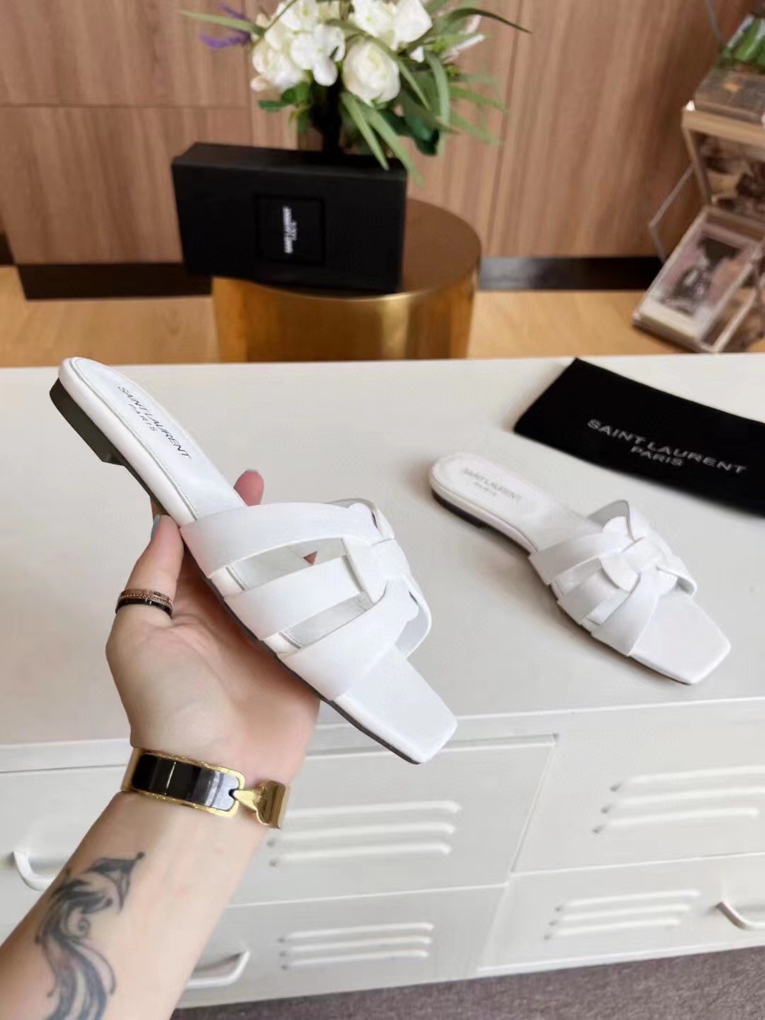 Sa**t Lau*nt tribute slides in white calfskin
