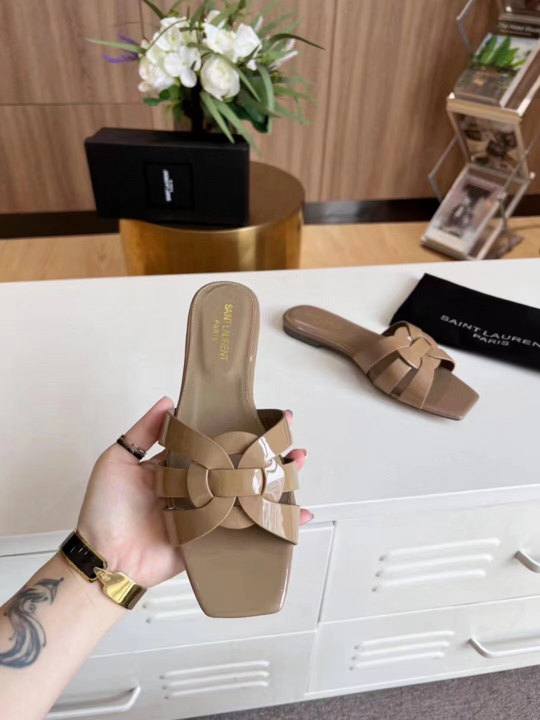 Sa**t Lau*nt tribute slides in dark beige patent leather