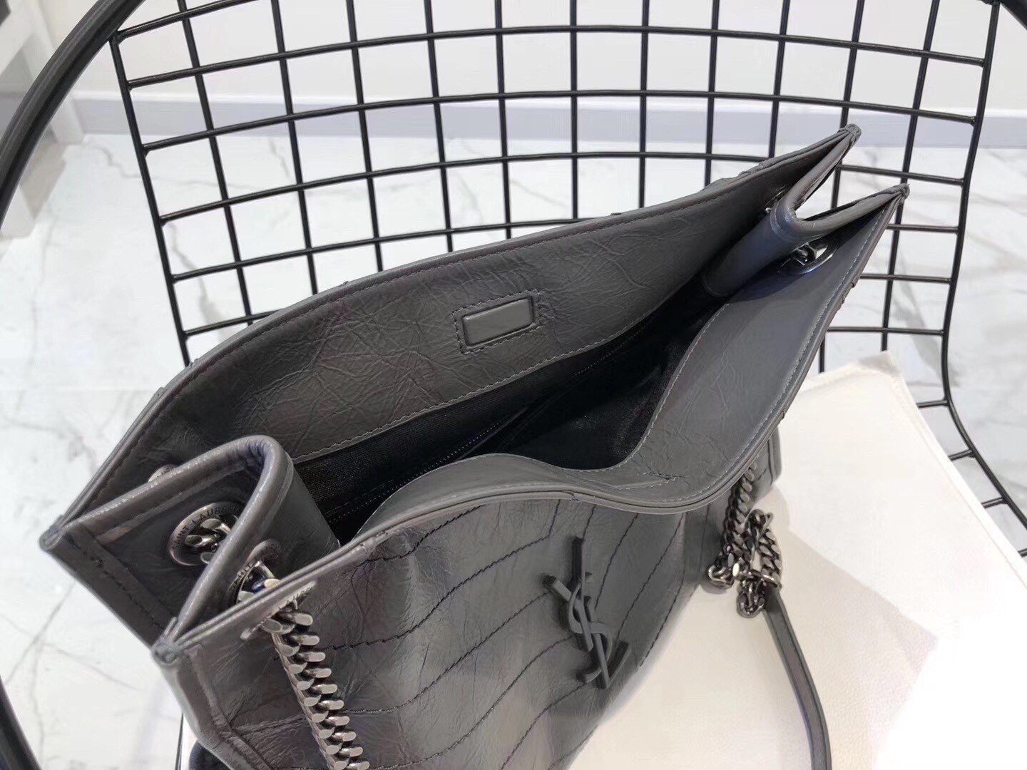 Sa**t Lau*nt medium niki shopping bag in storm leather