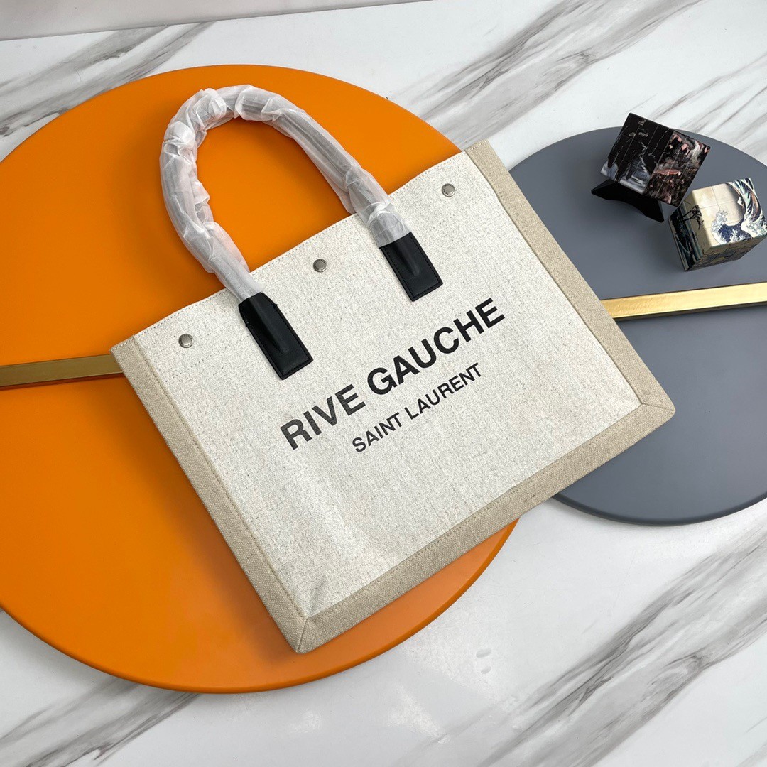 Sa**t Lau*nt rive gauche small tote bag in white linen and leather