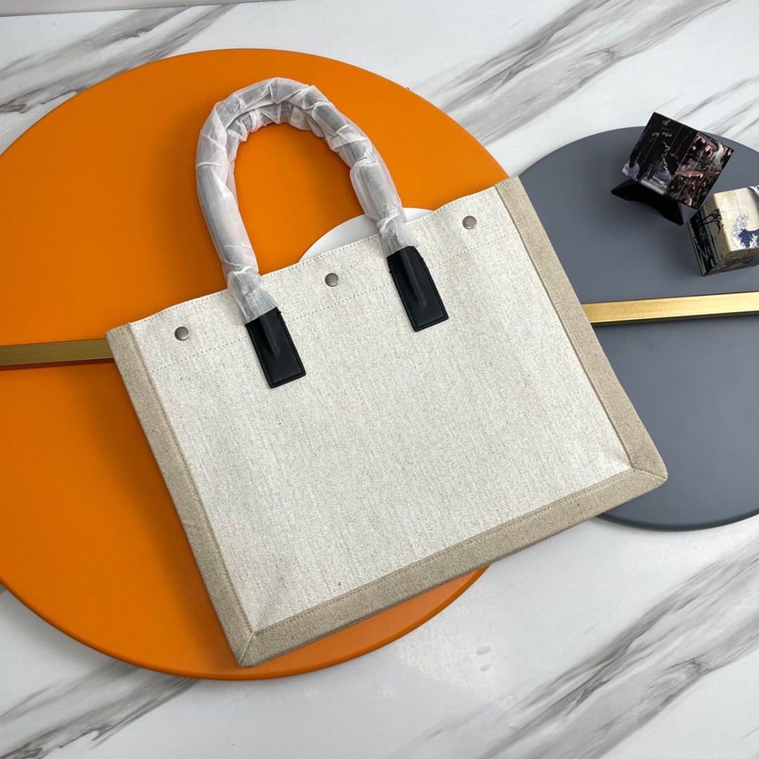 Sa**t Lau*nt rive gauche small tote bag in white linen and leather