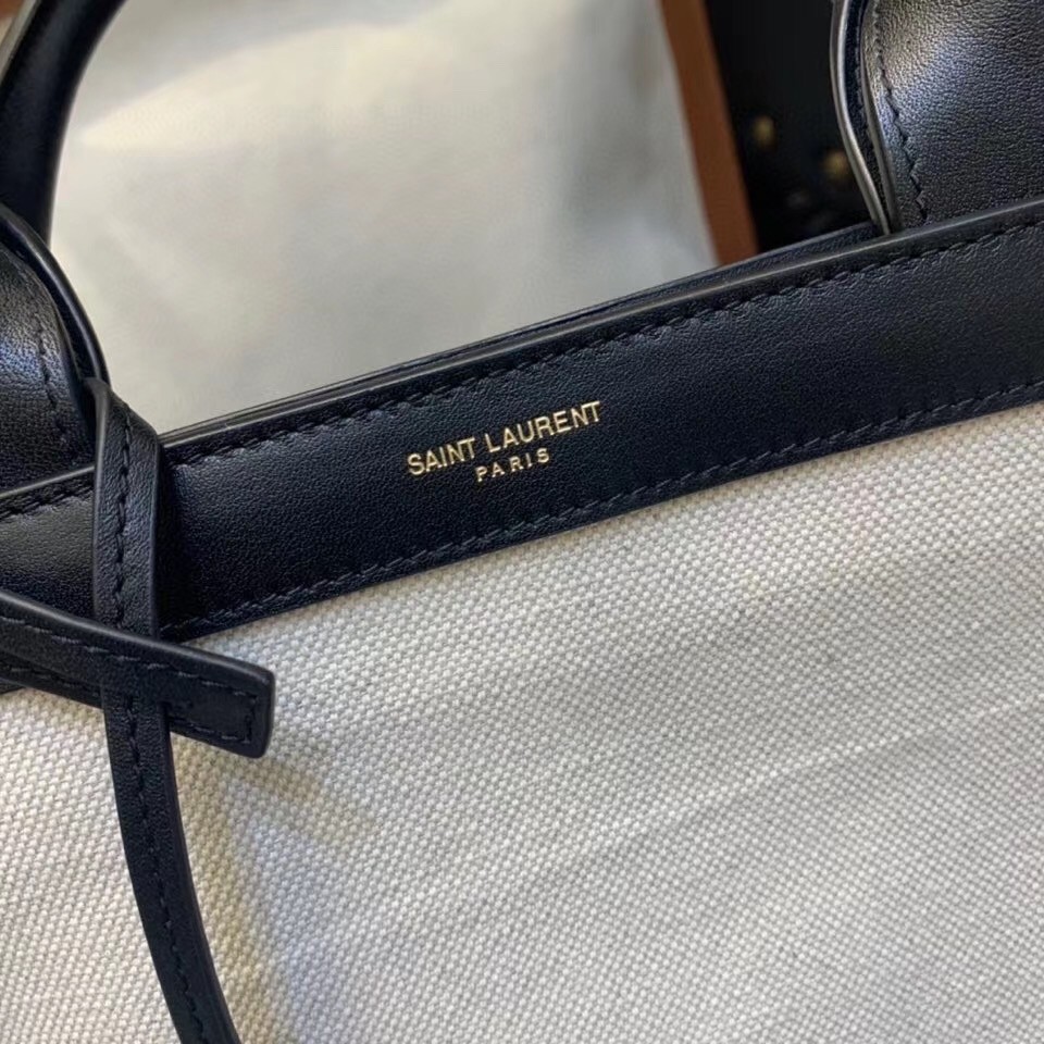 Sa**t Lau*nt tag shopping bag in canvas and black leather