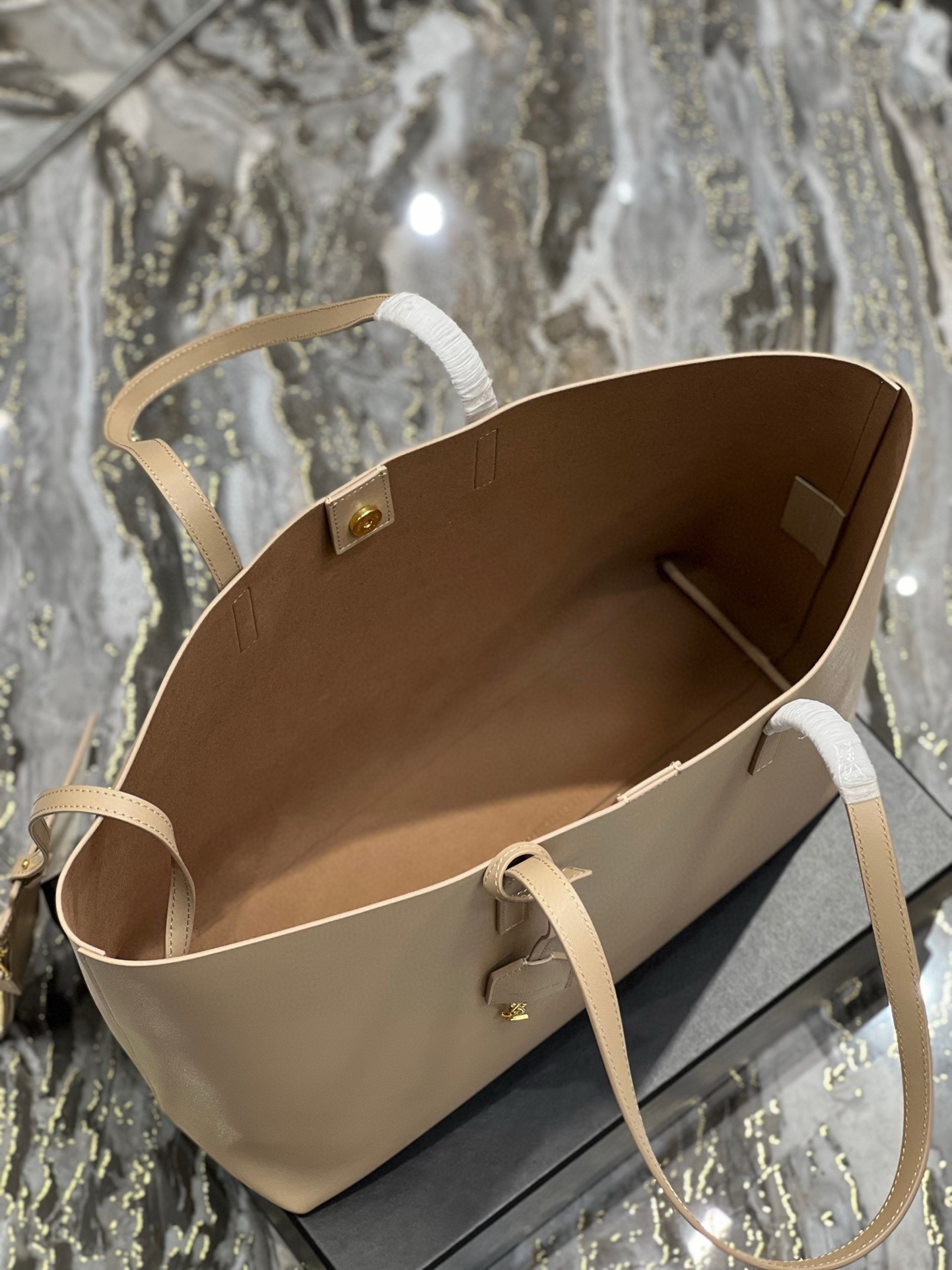 Sa**t Lau*nt shopping tote bag in beige leather
