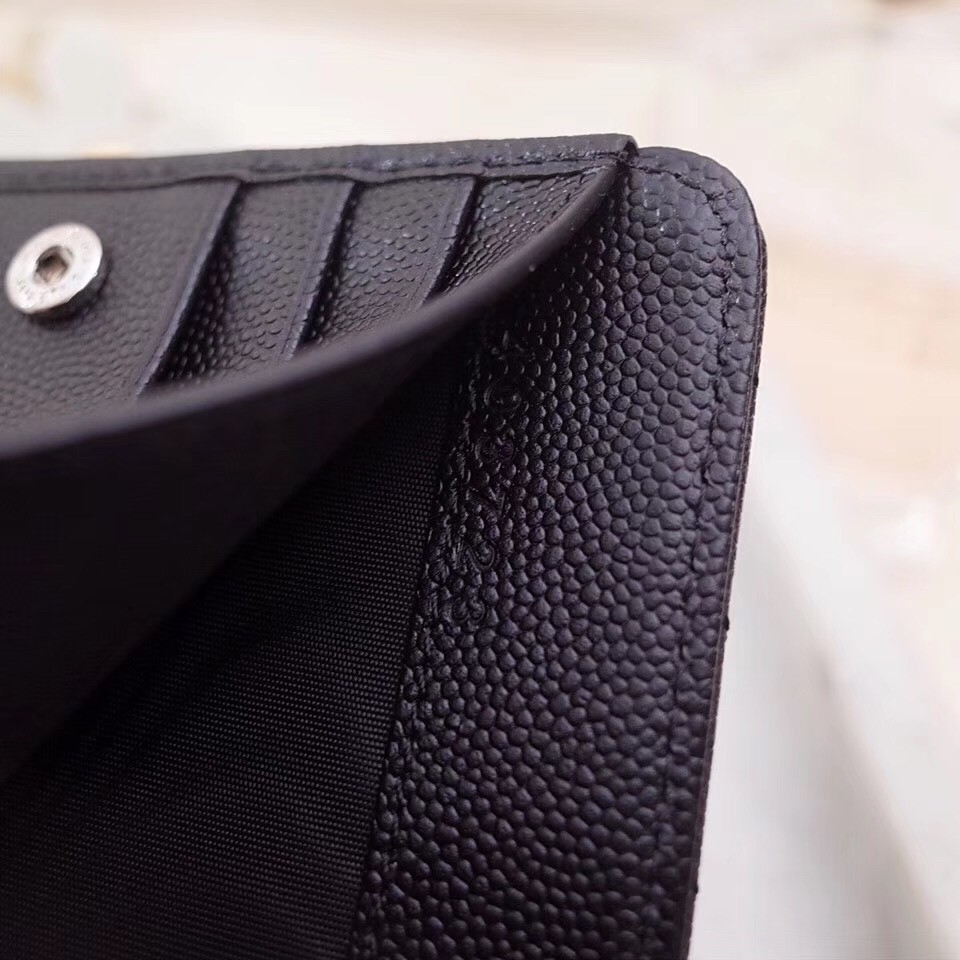 Sa**t Lau*nt compact zip around wallet in noir leather