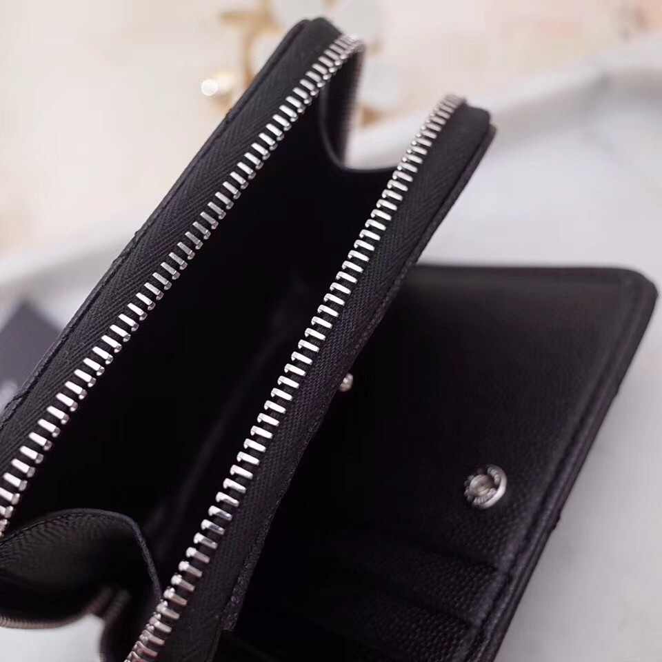 Sa**t Lau*nt compact zip around wallet in noir leather