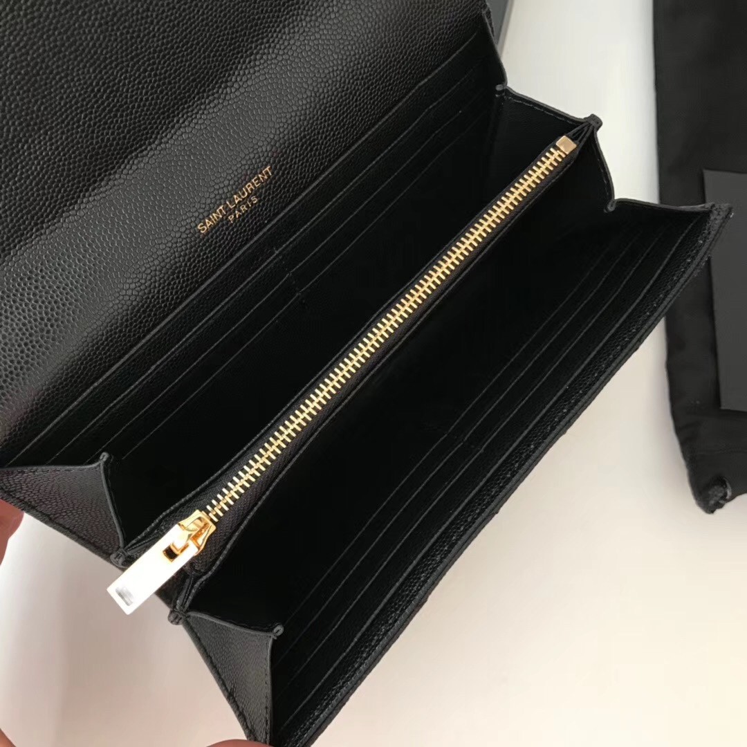 Sa**t Lau*nt large monogram flap wallet in black grained leather