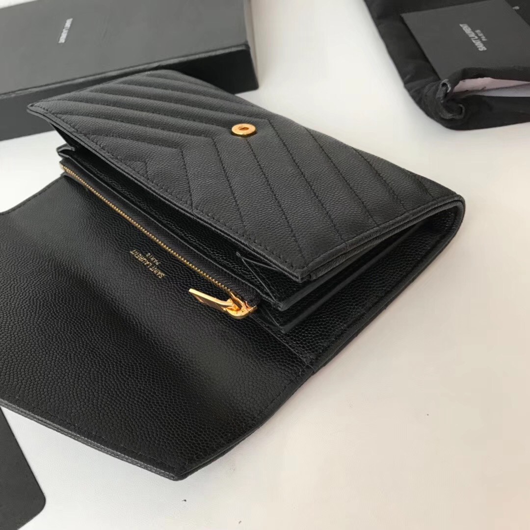 Sa**t Lau*nt large monogram flap wallet in black grained leather