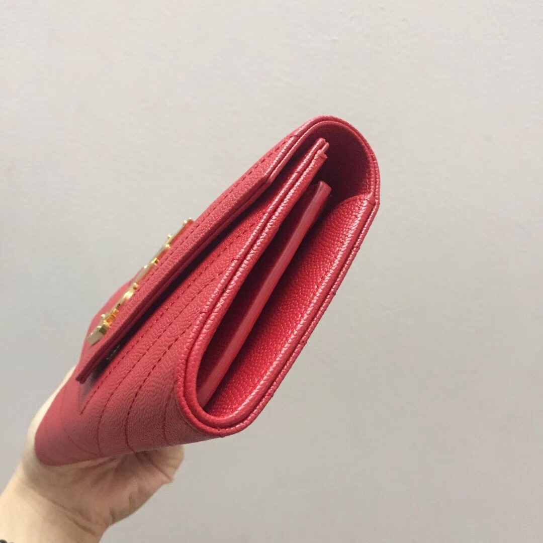 Sa**t Lau*nt large monogram flap wallet in red grained leather