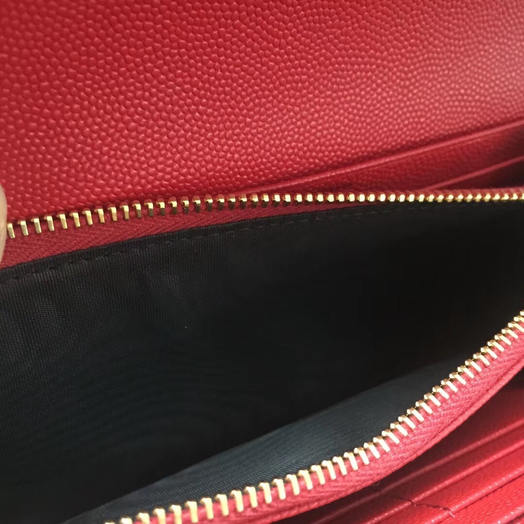 Sa**t Lau*nt large monogram flap wallet in red grained leather