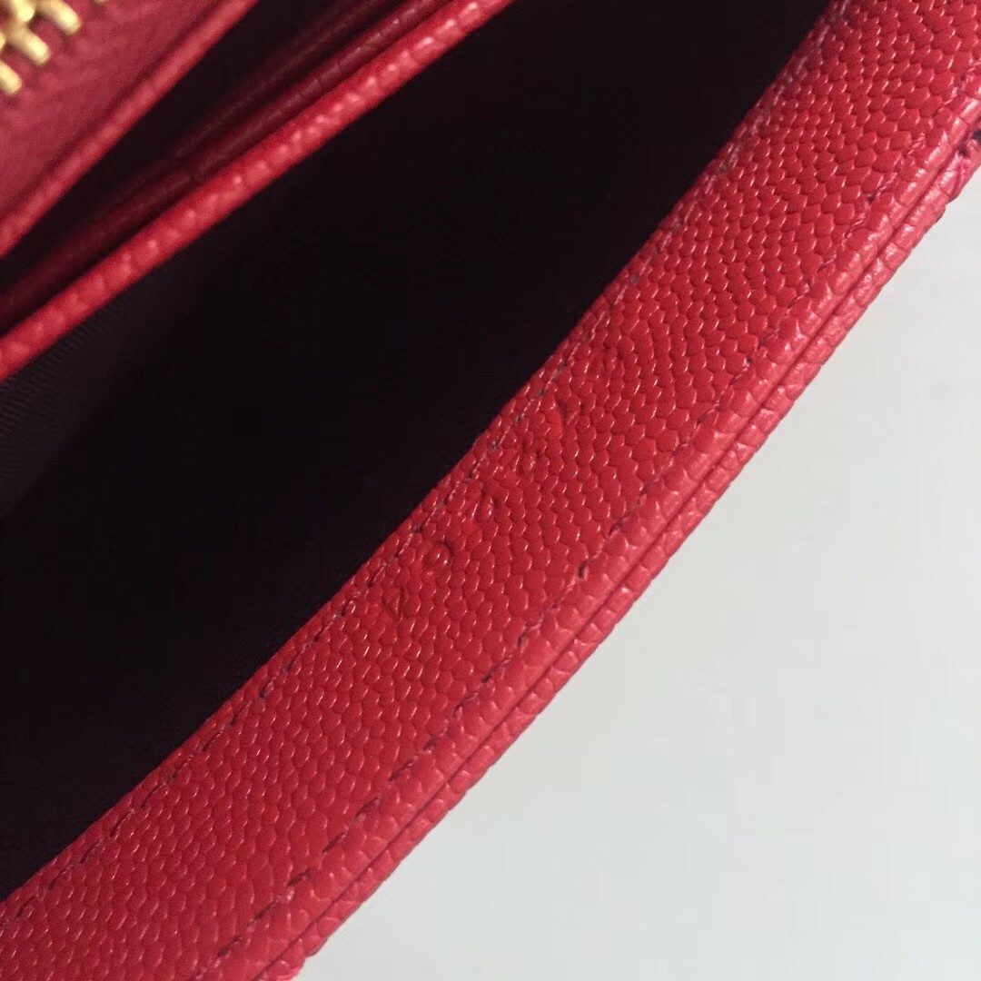 Sa**t Lau*nt large monogram flap wallet in red grained leather