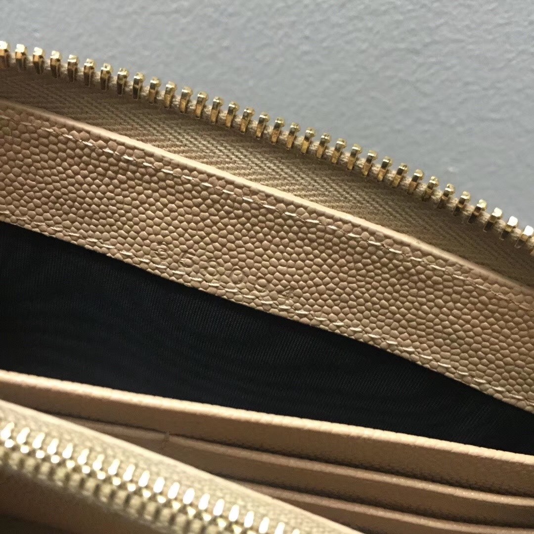 Sa**t Lau*nt monogram zip around wallet in powder grained leather