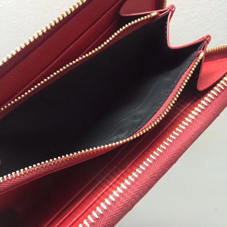 Sa**t Lau*nt monogram zip around wallet in red grained leather